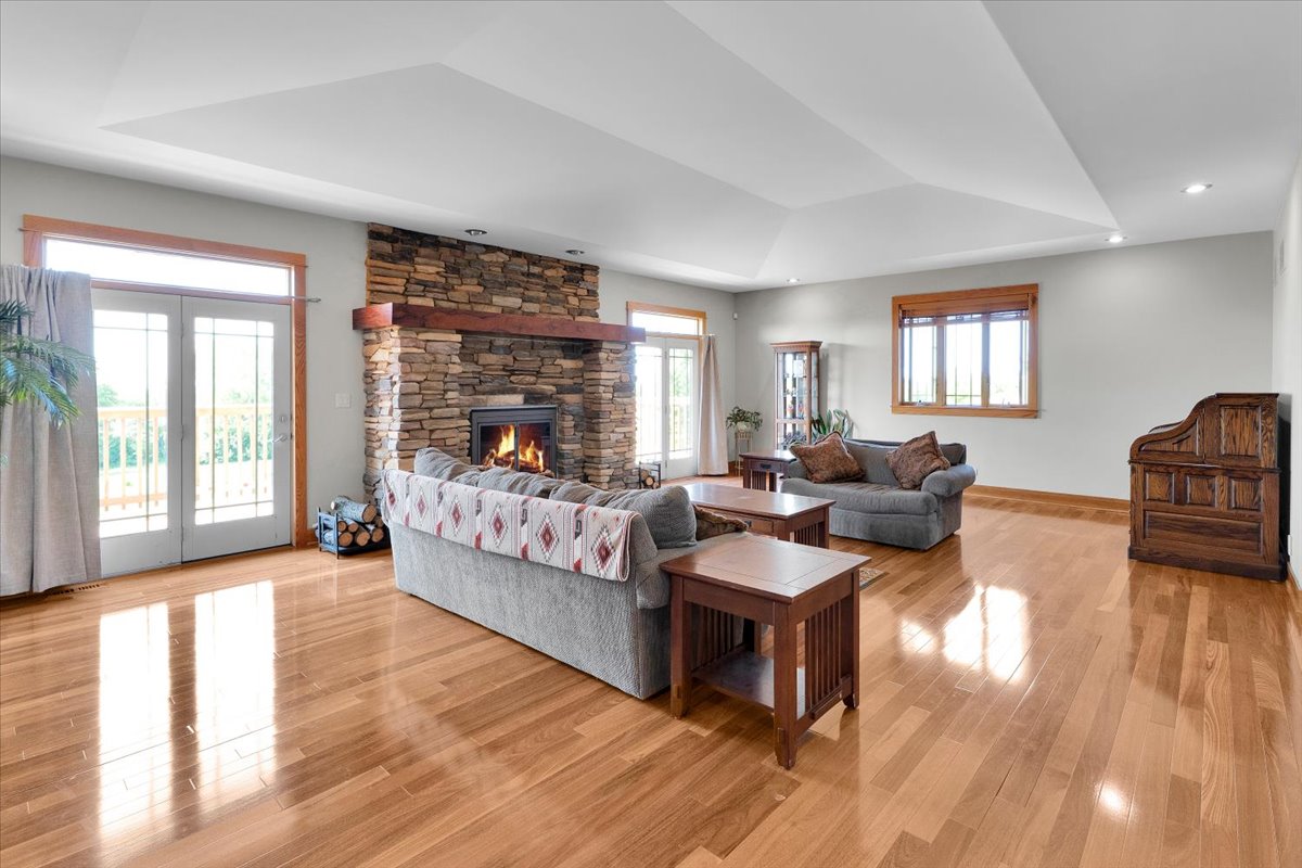 Great room with full-height stacked stone fireplace